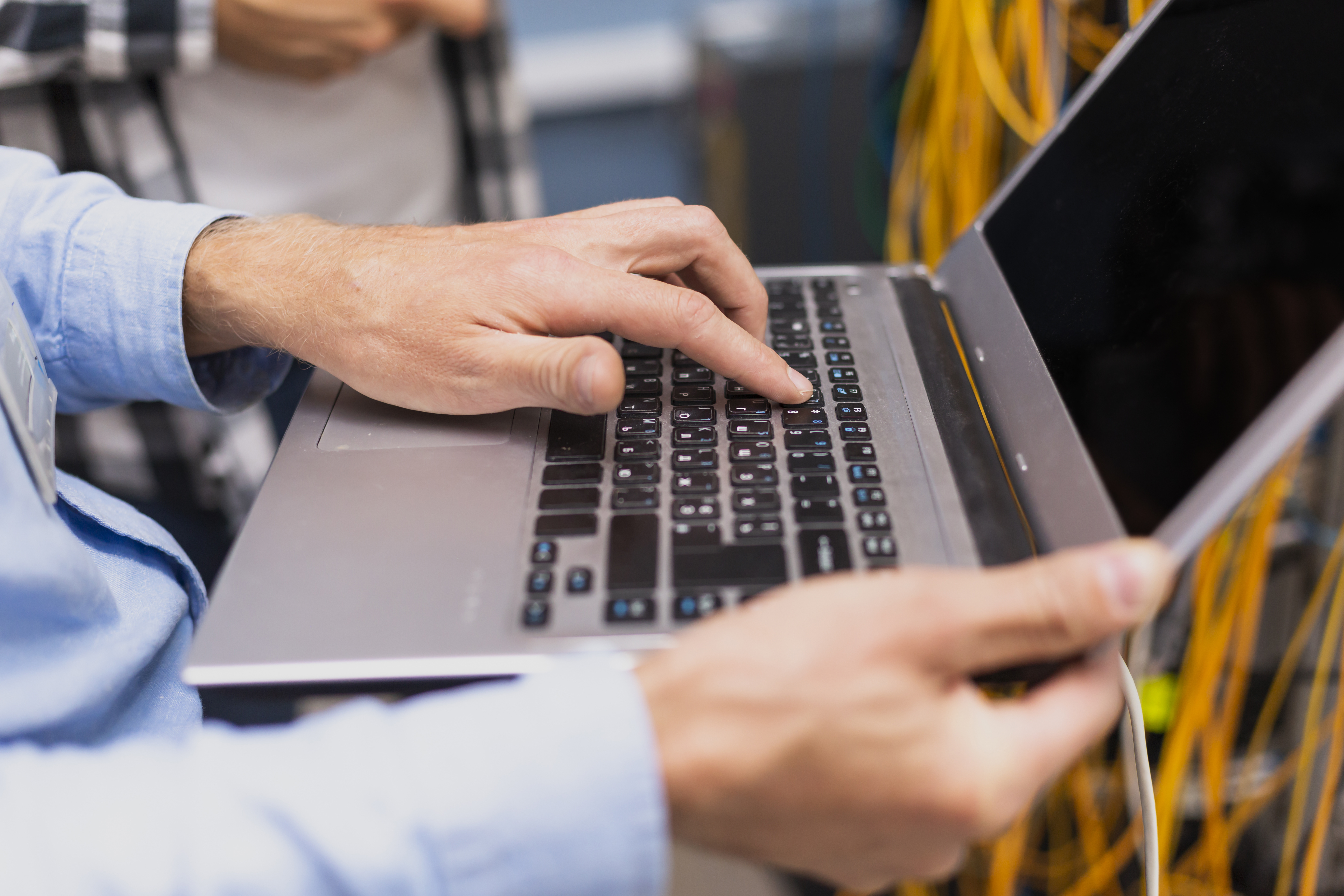 person-typing-laptop-close-up